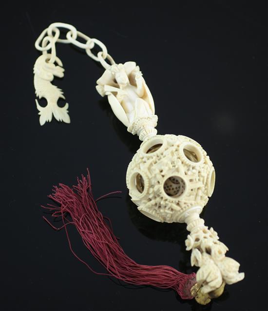 A Chinese export ivory hanging puzzle ball, 19th century, 34cm incl. chain